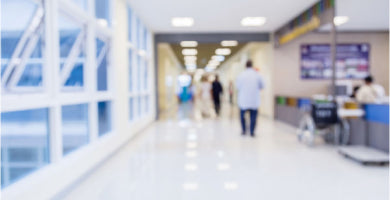 Hospital hallway with doctors, nurses, and patients